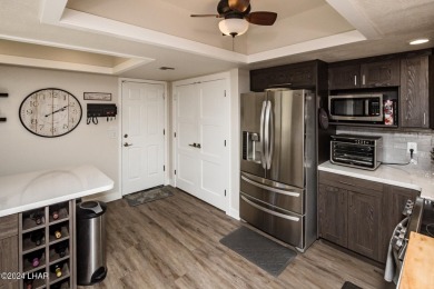 This golf course townhome is the perfect worry-free, lock and on London Bridge Golf Course in Arizona - for sale on GolfHomes.com, golf home, golf lot