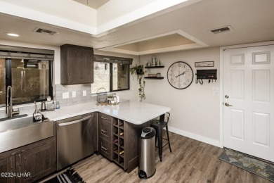 This golf course townhome is the perfect worry-free, lock and on London Bridge Golf Course in Arizona - for sale on GolfHomes.com, golf home, golf lot