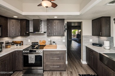 This golf course townhome is the perfect worry-free, lock and on London Bridge Golf Course in Arizona - for sale on GolfHomes.com, golf home, golf lot