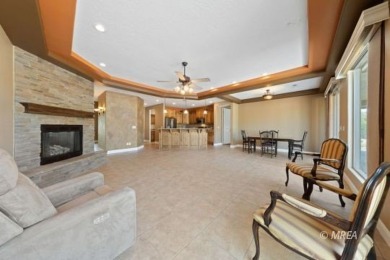 This beautifully designed home sits on a desirable corner lot on The Oasis Golf Club in Nevada - for sale on GolfHomes.com, golf home, golf lot