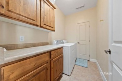 This beautifully designed home sits on a desirable corner lot on The Oasis Golf Club in Nevada - for sale on GolfHomes.com, golf home, golf lot