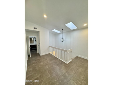 This golf course townhome is the perfect worry-free, lock and on London Bridge Golf Course in Arizona - for sale on GolfHomes.com, golf home, golf lot
