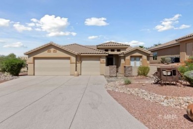 This beautifully designed home sits on a desirable corner lot on The Oasis Golf Club in Nevada - for sale on GolfHomes.com, golf home, golf lot