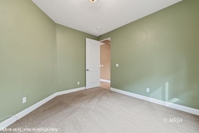 This beautifully designed home sits on a desirable corner lot on The Oasis Golf Club in Nevada - for sale on GolfHomes.com, golf home, golf lot