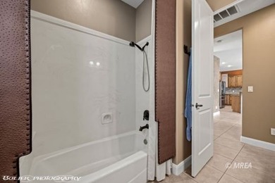 This beautifully designed home sits on a desirable corner lot on The Oasis Golf Club in Nevada - for sale on GolfHomes.com, golf home, golf lot