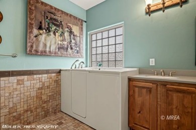 This beautifully designed home sits on a desirable corner lot on The Oasis Golf Club in Nevada - for sale on GolfHomes.com, golf home, golf lot