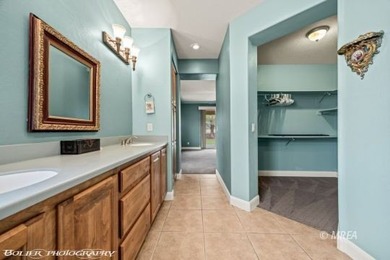 This beautifully designed home sits on a desirable corner lot on The Oasis Golf Club in Nevada - for sale on GolfHomes.com, golf home, golf lot