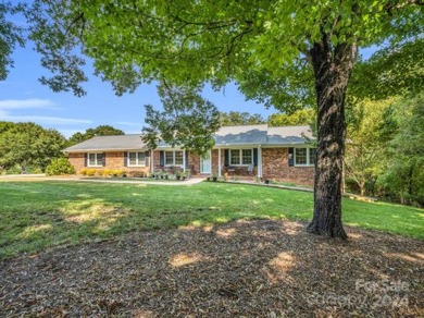 Located on Hole 15 of Riverbend Golf Course, this beautiful home on River Bend YMCA Golf Course in North Carolina - for sale on GolfHomes.com, golf home, golf lot