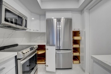 This expanded 2-bedroom, 2-bathroom Lakewood condo was renovated on Boca West Golf and Country Club in Florida - for sale on GolfHomes.com, golf home, golf lot