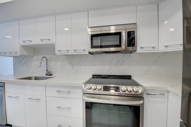 This expanded 2-bedroom, 2-bathroom Lakewood condo was renovated on Boca West Golf and Country Club in Florida - for sale on GolfHomes.com, golf home, golf lot