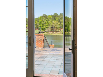 This exceptional three-level home is situated on an expansive on Woodside Plantation Country Club in South Carolina - for sale on GolfHomes.com, golf home, golf lot