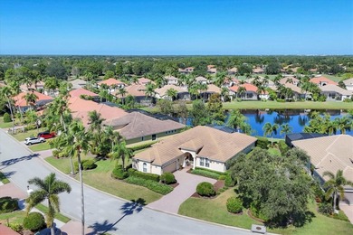 Situated on over a quarter acre of tranquil waterfront in the on Legacy Golf Club in Florida - for sale on GolfHomes.com, golf home, golf lot