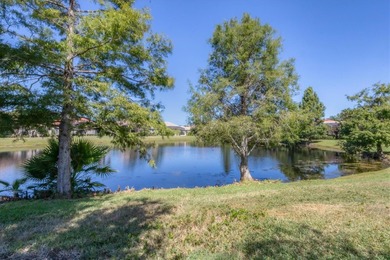 Situated on over a quarter acre of tranquil waterfront in the on Legacy Golf Club in Florida - for sale on GolfHomes.com, golf home, golf lot