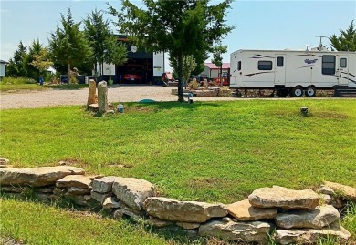 Welcome to your idyllic retreat at 14 Pinehurst Drive in serene on Linn Valley Lakes - Deer Trace Golf Course in Kansas - for sale on GolfHomes.com, golf home, golf lot