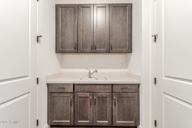 A heavily upgraded home (with office + pool) on an oversized lot on Sterling Grove Golf & Country Club in Arizona - for sale on GolfHomes.com, golf home, golf lot