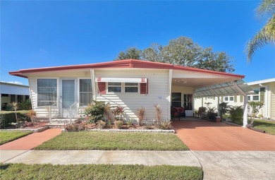 This beautifully maintained 3-bedroom home offers an on Fairway Village Golf Course in Florida - for sale on GolfHomes.com, golf home, golf lot