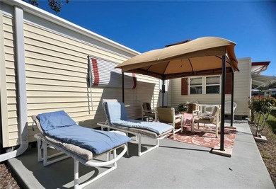 This beautifully maintained 3-bedroom home offers an on Fairway Village Golf Course in Florida - for sale on GolfHomes.com, golf home, golf lot