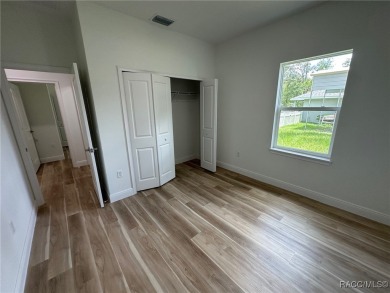 Discover this stunning, brand-new home in Citrus Springs on Citrus Springs Country Club in Florida - for sale on GolfHomes.com, golf home, golf lot