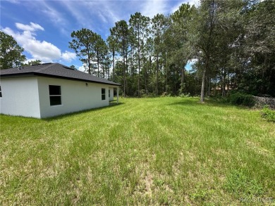 Discover this stunning, brand-new home in Citrus Springs on Citrus Springs Country Club in Florida - for sale on GolfHomes.com, golf home, golf lot