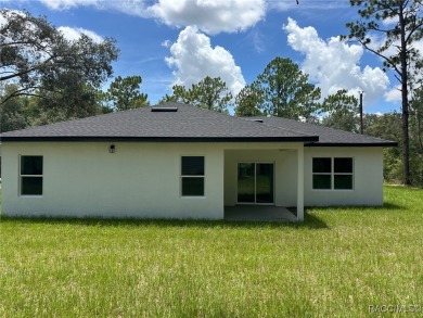 Discover this stunning, brand-new home in Citrus Springs on Citrus Springs Country Club in Florida - for sale on GolfHomes.com, golf home, golf lot