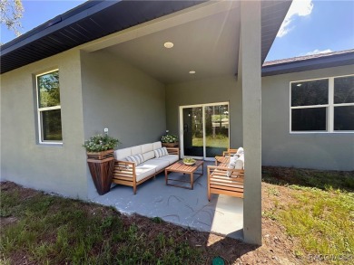 Discover this stunning, brand-new home in Citrus Springs on Citrus Springs Country Club in Florida - for sale on GolfHomes.com, golf home, golf lot