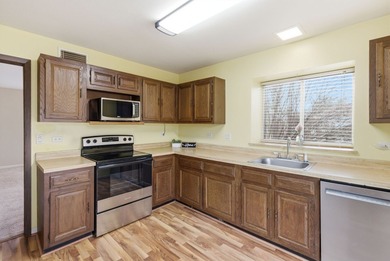 This desirable end-unit offers comfortable single-level living on Leisure Village Golf Course in Illinois - for sale on GolfHomes.com, golf home, golf lot