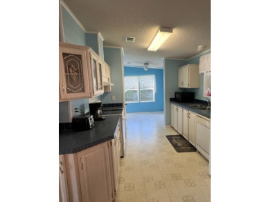 Beautiful waterfront home in The Hamptons Golf and Country Club on Hamptons Golf Club in Florida - for sale on GolfHomes.com, golf home, golf lot