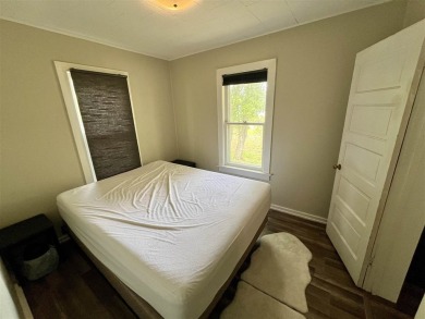 Cottage style home on Residential / Commercial lot. Located next on Charlevoix Golf Club in Michigan - for sale on GolfHomes.com, golf home, golf lot