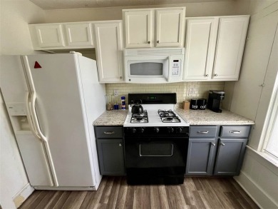 Cottage style home on Residential / Commercial lot. Located next on Charlevoix Golf Club in Michigan - for sale on GolfHomes.com, golf home, golf lot