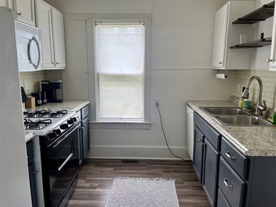 Cottage style home on Residential / Commercial lot. Located next on Charlevoix Golf Club in Michigan - for sale on GolfHomes.com, golf home, golf lot