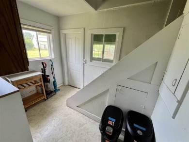 Cottage style home on Residential / Commercial lot. Located next on Charlevoix Golf Club in Michigan - for sale on GolfHomes.com, golf home, golf lot