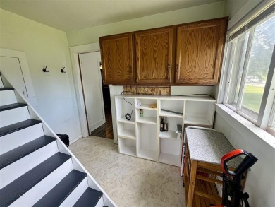 Cottage style home on Residential / Commercial lot. Located next on Charlevoix Golf Club in Michigan - for sale on GolfHomes.com, golf home, golf lot