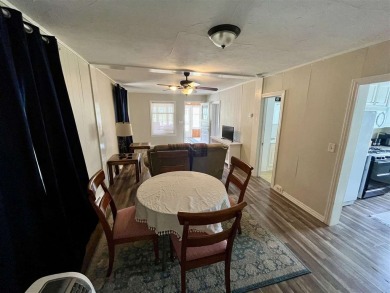 Cottage style home on Residential / Commercial lot. Located next on Charlevoix Golf Club in Michigan - for sale on GolfHomes.com, golf home, golf lot