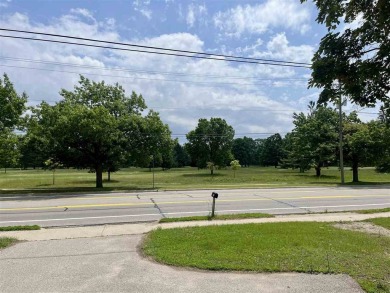 Cottage style home on Residential / Commercial lot. Located next on Charlevoix Golf Club in Michigan - for sale on GolfHomes.com, golf home, golf lot