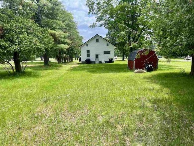 Cottage style home on Residential / Commercial lot. Located next on Charlevoix Golf Club in Michigan - for sale on GolfHomes.com, golf home, golf lot