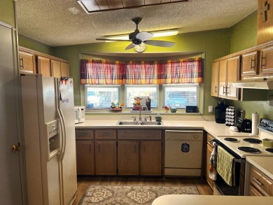 Experience comfortable living in this beautifully updated on Lake Henry Golf Club in Florida - for sale on GolfHomes.com, golf home, golf lot
