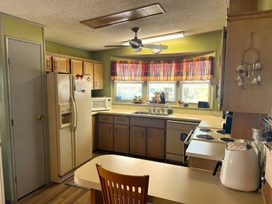 Experience comfortable living in this beautifully updated on Lake Henry Golf Club in Florida - for sale on GolfHomes.com, golf home, golf lot