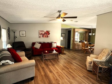 Experience comfortable living in this beautifully updated on Lake Henry Golf Club in Florida - for sale on GolfHomes.com, golf home, golf lot