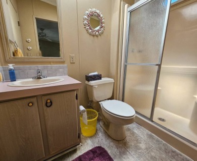 This home is located on leased land in a 55+ resort-style MH on Big Cypress Golf and Country Club in Florida - for sale on GolfHomes.com, golf home, golf lot