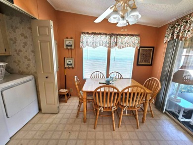 This home is located on leased land in a 55+ resort-style MH on Big Cypress Golf and Country Club in Florida - for sale on GolfHomes.com, golf home, golf lot