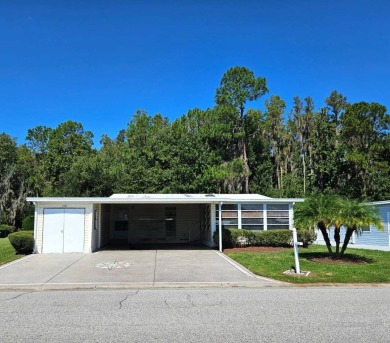 This home is located on leased land in a 55+ resort-style MH on Big Cypress Golf and Country Club in Florida - for sale on GolfHomes.com, golf home, golf lot