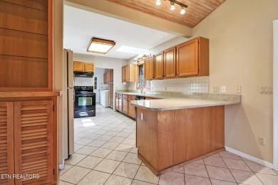 Looking for a warm, inviting home with a seasonal view of the on Druid Hills Golf Club in Tennessee - for sale on GolfHomes.com, golf home, golf lot