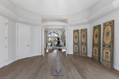 Nestled within the exclusive gated community of the Oaks Club in on The Oaks Club in Florida - for sale on GolfHomes.com, golf home, golf lot