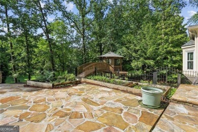 Tucked in Atlanta Country Club's quiet interior, this stately on Atlanta Country Club in Georgia - for sale on GolfHomes.com, golf home, golf lot