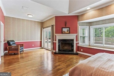 Tucked in Atlanta Country Club's quiet interior, this stately on Atlanta Country Club in Georgia - for sale on GolfHomes.com, golf home, golf lot