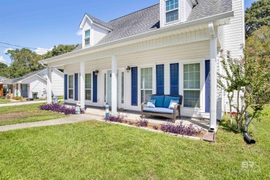 Discover this charming cottage with impressive curb appeal on Lake Forest Yacht and Country Club in Alabama - for sale on GolfHomes.com, golf home, golf lot