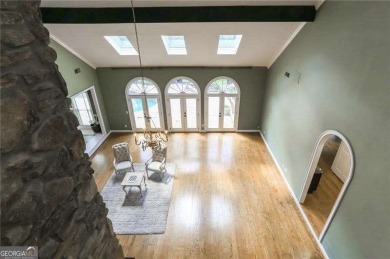 Tucked in Atlanta Country Club's quiet interior, this stately on Atlanta Country Club in Georgia - for sale on GolfHomes.com, golf home, golf lot