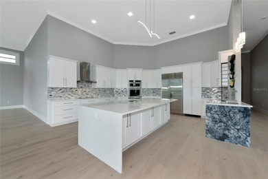 **BRILLIANTLY UPDATED, MOVE-IN READY, GOLF COURSE ESTATE in the on The Oaks Club in Florida - for sale on GolfHomes.com, golf home, golf lot