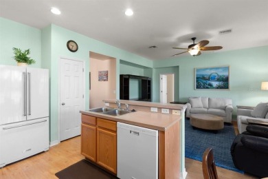 Welcome to this charming three-bedroom, two-bathroom home with a on Deep Creek Golf Club in Florida - for sale on GolfHomes.com, golf home, golf lot