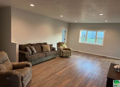 Let's take a look at this new build in Akron, Iowa. This on Akron Golf Course in Iowa - for sale on GolfHomes.com, golf home, golf lot